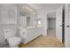 Bathroom features double sinks, tile floors, and a window at 11009 Pentland Downs St, Las Vegas, NV 89141