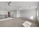 Bright bonus room with carpet, a railing overlooking the floor below, and a stylish ceiling fan at 11009 Pentland Downs St, Las Vegas, NV 89141
