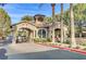 A guarded entry gate to a residential community with attractive landscaping and a paved driveway at 11009 Pentland Downs St, Las Vegas, NV 89141