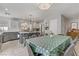 Open concept kitchen and dining area featuring a stylish island and stainless steel appliances at 11009 Pentland Downs St, Las Vegas, NV 89141