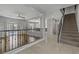 Open-concept living area with hardwood floors, a staircase, and views to the kitchen and backyard pool at 11009 Pentland Downs St, Las Vegas, NV 89141