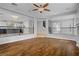 Spacious living area boasts wood floors, an open layout, and access to the upper and lower floors at 11009 Pentland Downs St, Las Vegas, NV 89141