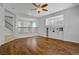 Open living space features wood floors, a fireplace, and built-in shelving for entertainment at 11009 Pentland Downs St, Las Vegas, NV 89141