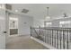 Upstairs loft with access to the full bathroom with gray vanity and views of the window at 11009 Pentland Downs St, Las Vegas, NV 89141