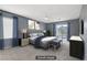 Spacious bedroom with plush carpeting, a large bed, balcony access, and stylish curtains at 11009 Pentland Downs St, Las Vegas, NV 89141