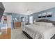 Comfortable main bedroom featuring stylish blue walls, and plush bedding at 11009 Pentland Downs St, Las Vegas, NV 89141