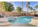 Inviting backyard pool and spa surrounded by lush landscaping and a privacy wall for outdoor enjoyment at 11009 Pentland Downs St, Las Vegas, NV 89141