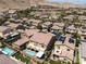 Desirable neighborhood with houses featuring private backyards, some with pools, surrounded by mountains in the distance at 12296 Kings Eagle St, Las Vegas, NV 89141