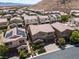 Spacious neighborhood view of the home with a tile roof, solar panels, and landscaping at 12296 Kings Eagle St, Las Vegas, NV 89141