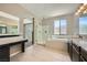 Bathroom features a separate shower and tub and double vanity at 12296 Kings Eagle St, Las Vegas, NV 89141