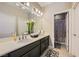 Well-lit bathroom featuring double sinks and neutral color scheme at 12296 Kings Eagle St, Las Vegas, NV 89141