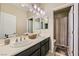 Bathroom featuring dual sinks, neutral colors, and a shower/tub combination at 12296 Kings Eagle St, Las Vegas, NV 89141