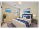 Comfortable bedroom featuring a plush bed, neutral tones, and bright decor at 12296 Kings Eagle St, Las Vegas, NV 89141