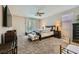 Cozy bedroom with carpet, large window and comfortable furniture at 12296 Kings Eagle St, Las Vegas, NV 89141