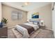 Comfortable bedroom with carpet, a large window and a blue bedding at 12296 Kings Eagle St, Las Vegas, NV 89141