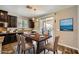 Dining room with dark cabinetry, and sliding glass doors providing natural light at 12296 Kings Eagle St, Las Vegas, NV 89141