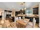 Spacious kitchen with granite countertops, stainless steel appliances, and hardwood flooring at 12296 Kings Eagle St, Las Vegas, NV 89141