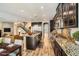 A sleek kitchen featuring granite countertops, stainless appliances, and hardwood flooring at 12296 Kings Eagle St, Las Vegas, NV 89141