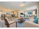 Bright upstairs living room with comfortable seating and access to railing and balcony at 12296 Kings Eagle St, Las Vegas, NV 89141