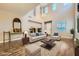 Airy living room with a neutral color palette, modern decor, and high ceilings at 12296 Kings Eagle St, Las Vegas, NV 89141