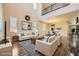 Bright, staged living room boasts soaring ceilings, natural light, and elegant decor at 12296 Kings Eagle St, Las Vegas, NV 89141