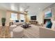 Bright living room featuring a fireplace, neutral color palette, and hardwood floors at 12296 Kings Eagle St, Las Vegas, NV 89141
