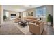 Spacious living room with plush seating, natural light and neutral color at 12296 Kings Eagle St, Las Vegas, NV 89141