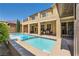 Stunning backyard pool and patio area with an outdoor kitchen, perfect for enjoying sunny days and entertaining guests at 12296 Kings Eagle St, Las Vegas, NV 89141