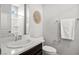 Modern bathroom with a clean and simple design and ample lighting at 12705 Coastline Shadow St, Las Vegas, NV 89141
