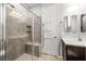 Bathroom featuring a walk-in shower with glass door and vanity with sink at 12705 Coastline Shadow St, Las Vegas, NV 89141
