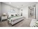 Bedroom featuring ensuite bath, walk-in closet, and neutral decor at 12705 Coastline Shadow St, Las Vegas, NV 89141