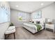 Serene bedroom with neutral colors, comfortable bed, and bright natural light at 12705 Coastline Shadow St, Las Vegas, NV 89141
