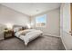 Bedroom featuring neutral carpet, window with shutters, ensuite bath and walk-in closet at 12705 Coastline Shadow St, Las Vegas, NV 89141