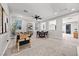 Spacious game room with foosball table, ceiling fan and comfortable dining area at 12705 Coastline Shadow St, Las Vegas, NV 89141