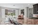 Modern kitchen with an island and a view, blending functionality with aesthetic appeal for cooking and dining experiences at 12705 Coastline Shadow St, Las Vegas, NV 89141