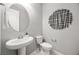 Elegant powder room with modern sink, fixtures and decorative wall art at 12705 Coastline Shadow St, Las Vegas, NV 89141
