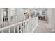 View of the bright, carpeted upstairs space, showing a game room and other rooms at 12705 Coastline Shadow St, Las Vegas, NV 89141