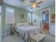 Inviting bedroom with a ceiling fan and a connecting bathroom, perfect for relaxation and convenience at 15 Avenza Dr, Henderson, NV 89011