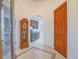 Foyer featuring tile floors and archway to a wet bar, with a grandfather clock at 15 Avenza Dr, Henderson, NV 89011