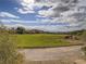 Beautiful golf course view with rolling hills, blue skies, and distant mountain views at 15 Avenza Dr, Henderson, NV 89011