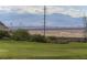 Picturesque golf course view with city skyline in the distance, offering a scenic and peaceful setting at 15 Avenza Dr, Henderson, NV 89011
