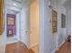 Hallway with hardwood floors leading to rooms with neutral color palettes and attractive trim at 15 Avenza Dr, Henderson, NV 89011
