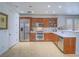 Kitchen with stainless steel appliances, light-colored countertops, and wooden cabinets at 15 Avenza Dr, Henderson, NV 89011