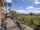 Relaxing patio with chairs and lush landscaping, offering serene golf course views and privacy at 15 Avenza Dr, Henderson, NV 89011