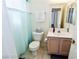 This tidy bathroom offers a toilet, sink, vanity, and a rod for a shower curtain or door at 1605 Crimson Hills Dr # 204, Las Vegas, NV 89128