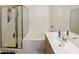 Neat bathroom featuring a shower, bathtub, and vanity with drawers at 1605 Crimson Hills Dr # 204, Las Vegas, NV 89128