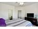 Inviting bedroom featuring a ceiling fan and en suite bathroom at 1605 Crimson Hills Dr # 204, Las Vegas, NV 89128