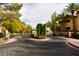 Gated community entrance with lush landscaping and secure access at 1605 Crimson Hills Dr # 204, Las Vegas, NV 89128