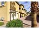 Beautiful townhome features a private garage and lush landscaping at 1605 Crimson Hills Dr # 204, Las Vegas, NV 89128