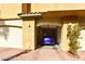 The exterior shows the home's one car garage with a car parked inside at 1605 Crimson Hills Dr # 204, Las Vegas, NV 89128